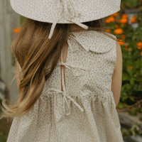 Elma Colette Dress in Haru Blossom Iris, featuring delicate purple florals on Japanese-milled cotton, a Peter Pan collar, back ties and a gathered skirt.