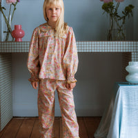 Girl wearing the Margaret Blouse and Lucie Pants in Liberty Morley Hill floral.