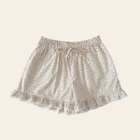 Elma Lilia Shorts in Japanese Ditsy floral, featuring an elasticated drawstring waistband, side pockets and ruffled hems with delicate white picot lace trim.
