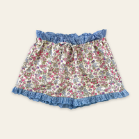 Elma Molly Shorts in Liberty Nancy Ann floral print, featuring embroidered lace trim, an elasticated self-tie waistband and side pockets.