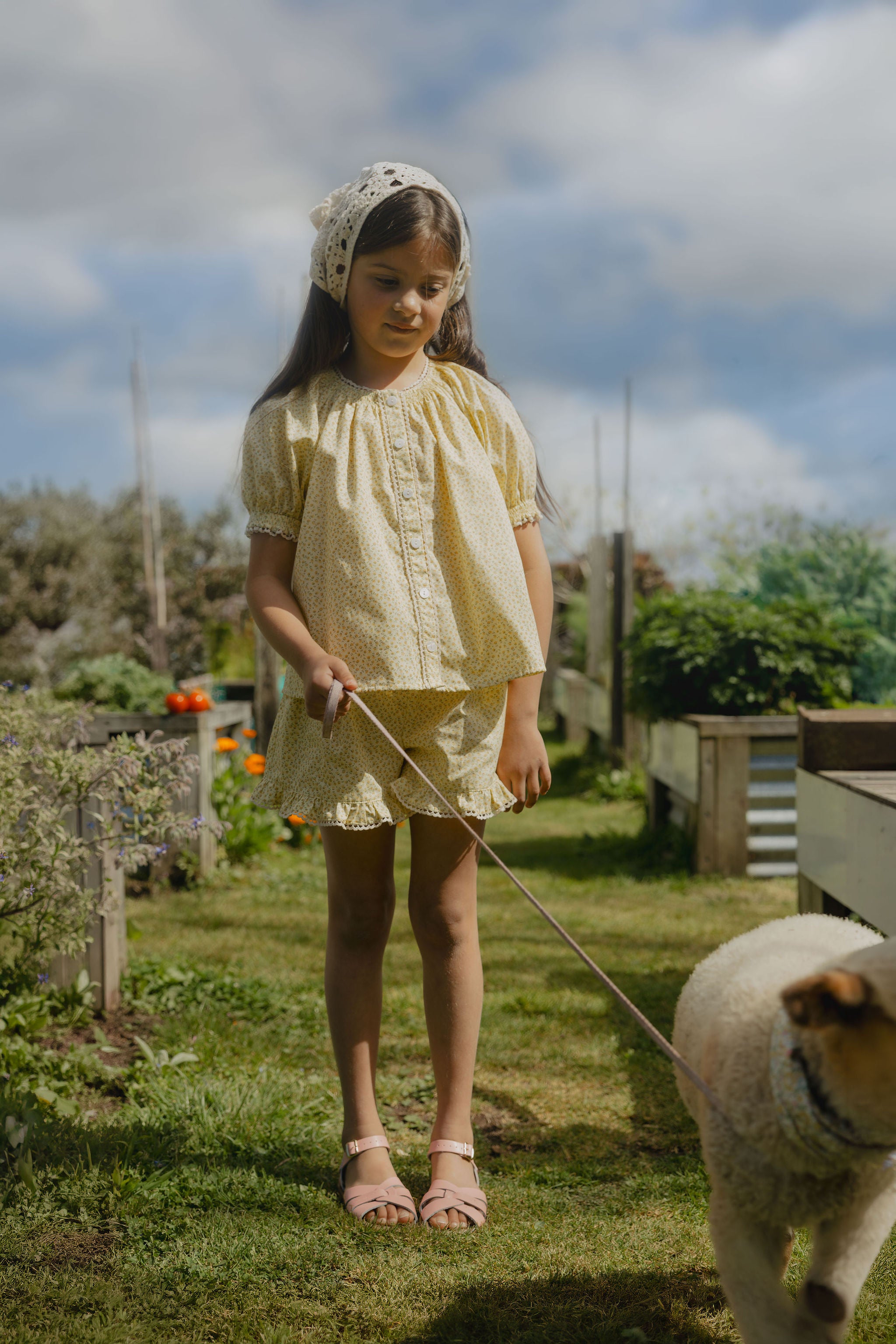 Elma Lilia Shorts in Japanese Ditsy floral, featuring an elasticated drawstring waistband, side pockets and ruffled hems with delicate white picot lace trim.