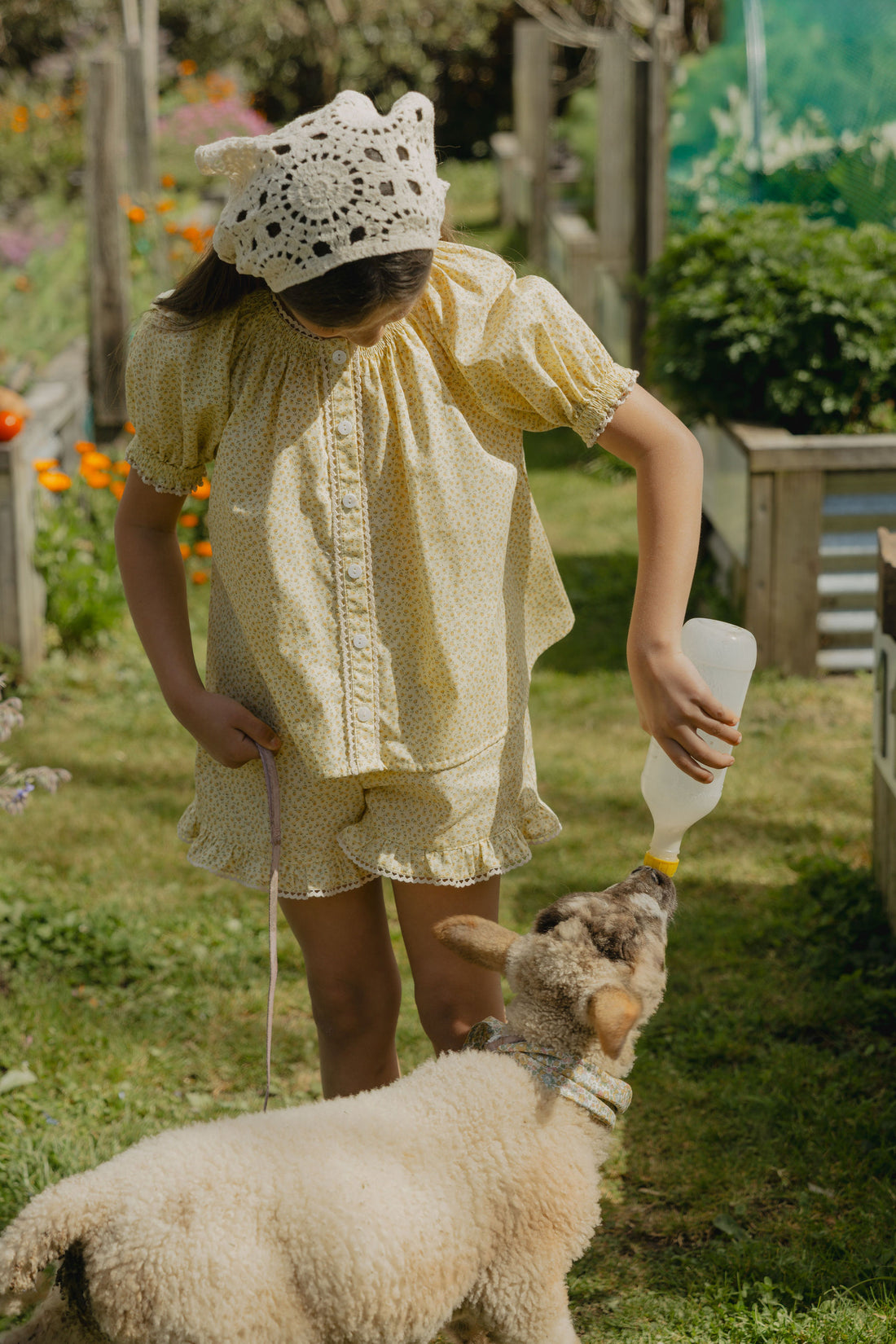 Elma Delphi Blouse in Haru Blossom Buttercup, featuring tiny yellow florals on buttery-yellow Japanese cotton, puff sleeves, shirred cuffs and picot lace trim.
