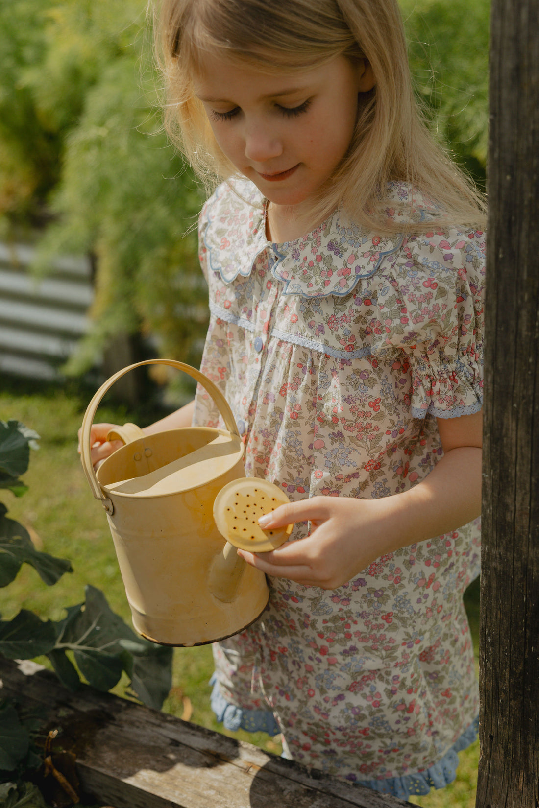 Honey Blouse in Liberty Nancy Ann floral print, featuring a scalloped Peter Pan collar, delicate lace trim, blue buttons and short puff sleeves
