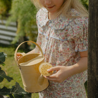 Honey Blouse in Liberty Nancy Ann floral print, featuring a scalloped Peter Pan collar, delicate lace trim, blue buttons and short puff sleeves