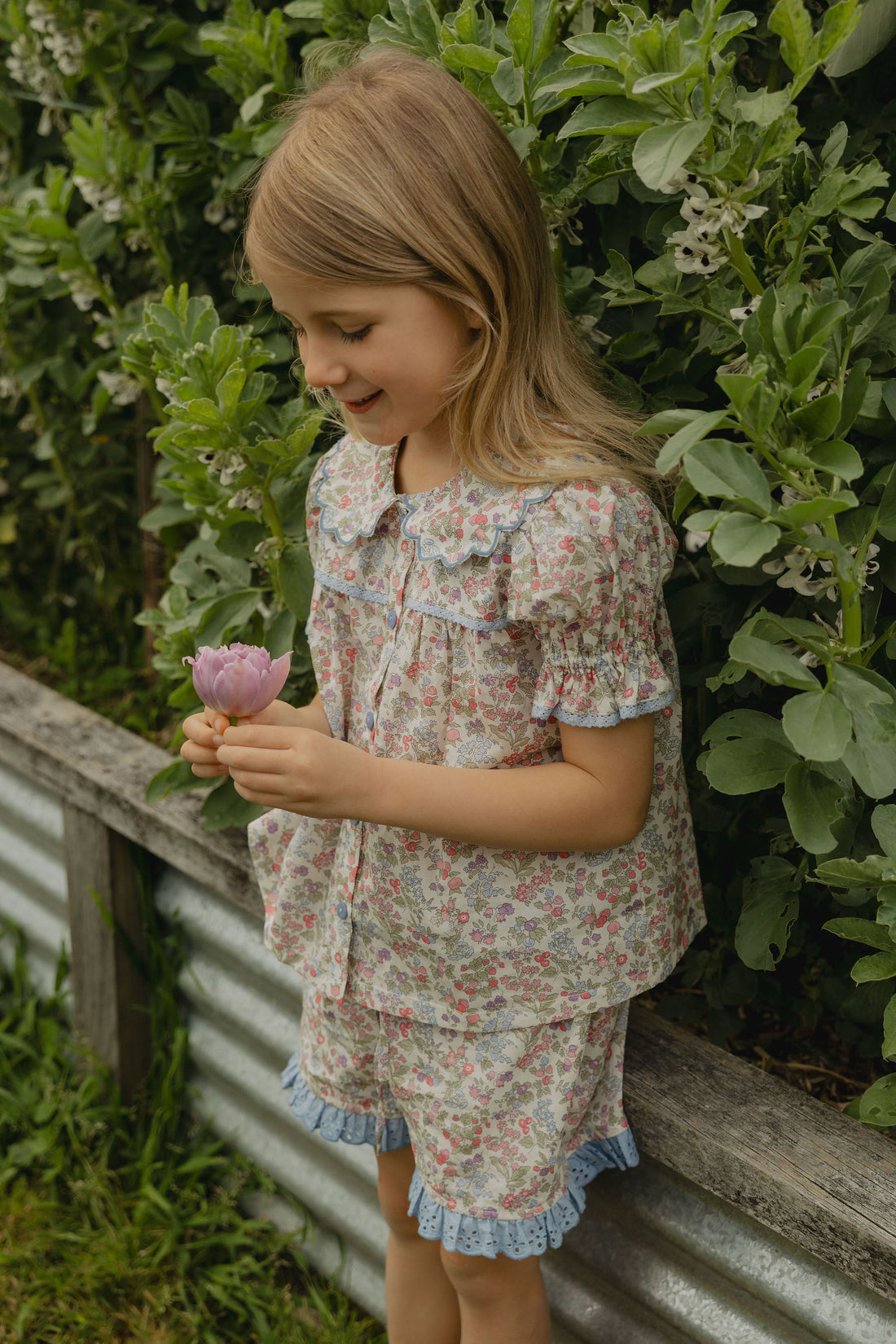 Elma Molly Shorts in Liberty Nancy Ann floral print, featuring embroidered lace trim, an elasticated self-tie waistband and side pockets.