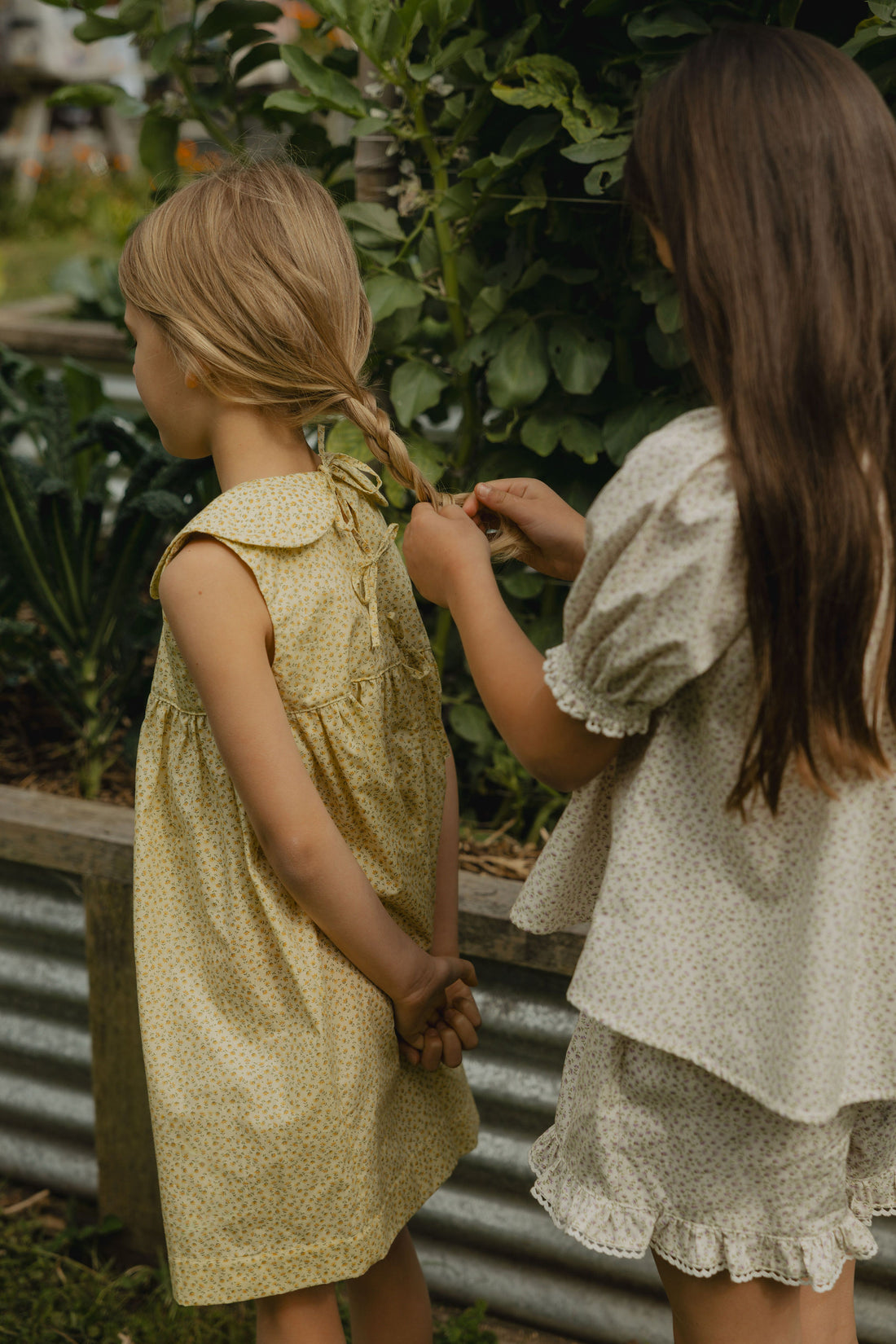 Elma Lilia Shorts in Japanese Ditsy floral, featuring an elasticated drawstring waistband, side pockets and ruffled hems with delicate white picot lace trim.