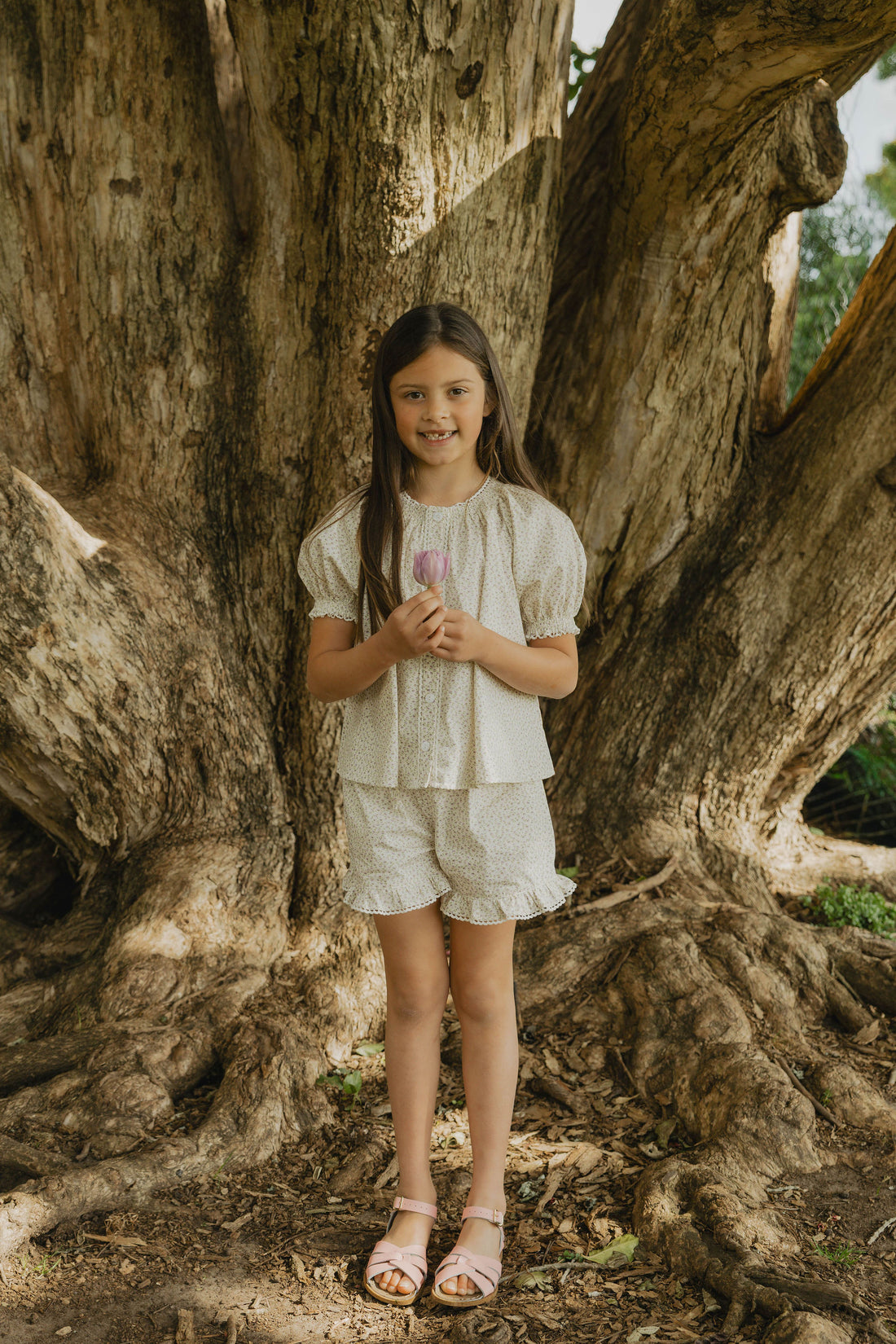 Elma Lilia Shorts in Japanese Ditsy floral, featuring an elasticated drawstring waistband, side pockets and ruffled hems with delicate white picot lace trim.