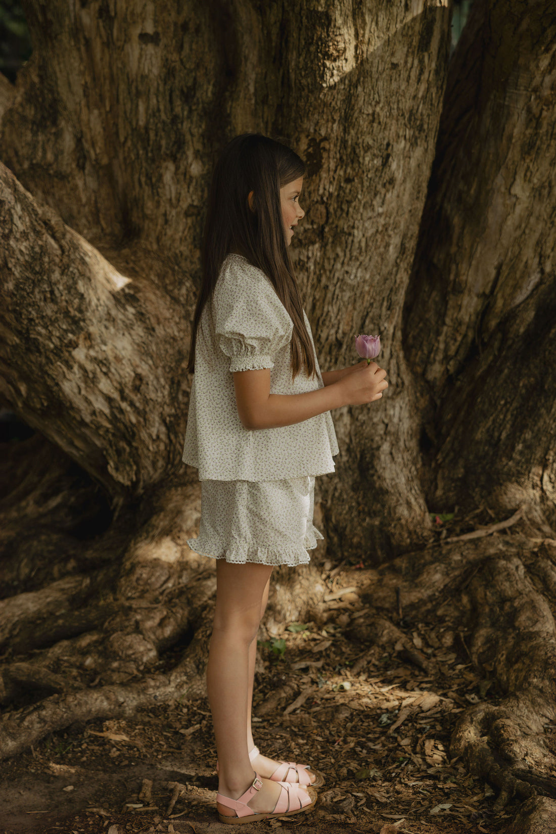 Elma Lilia Shorts in Japanese Ditsy floral, featuring an elasticated drawstring waistband, side pockets and ruffled hems with delicate white picot lace trim.