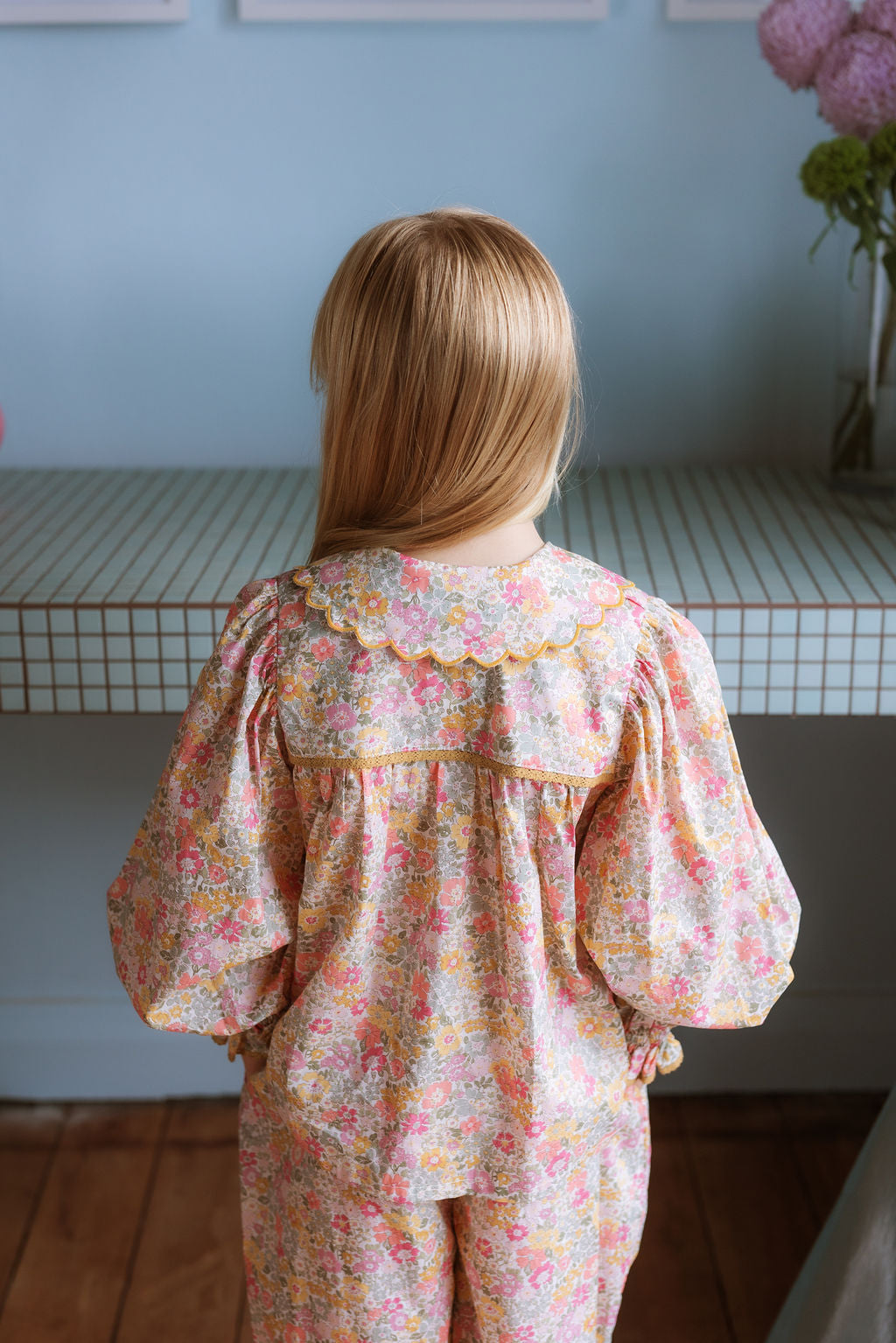 Girl wearing the Margaret Blouse in Liberty Morley Hill floral with scalloped Peter Pan collar and lace trim.