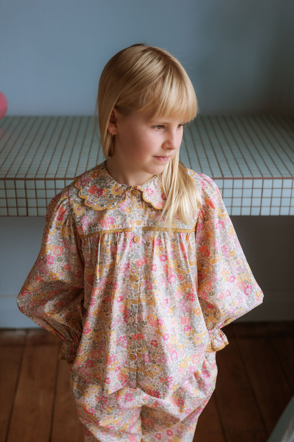 Girl wearing the Margaret Blouse in Liberty Morley Hill floral with scalloped Peter Pan collar and lace trim.