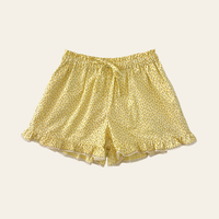 Elma Lilia Shorts in Japanese Ditsy floral, featuring an elasticated drawstring waistband, side pockets and ruffled hems with delicate white picot lace trim.