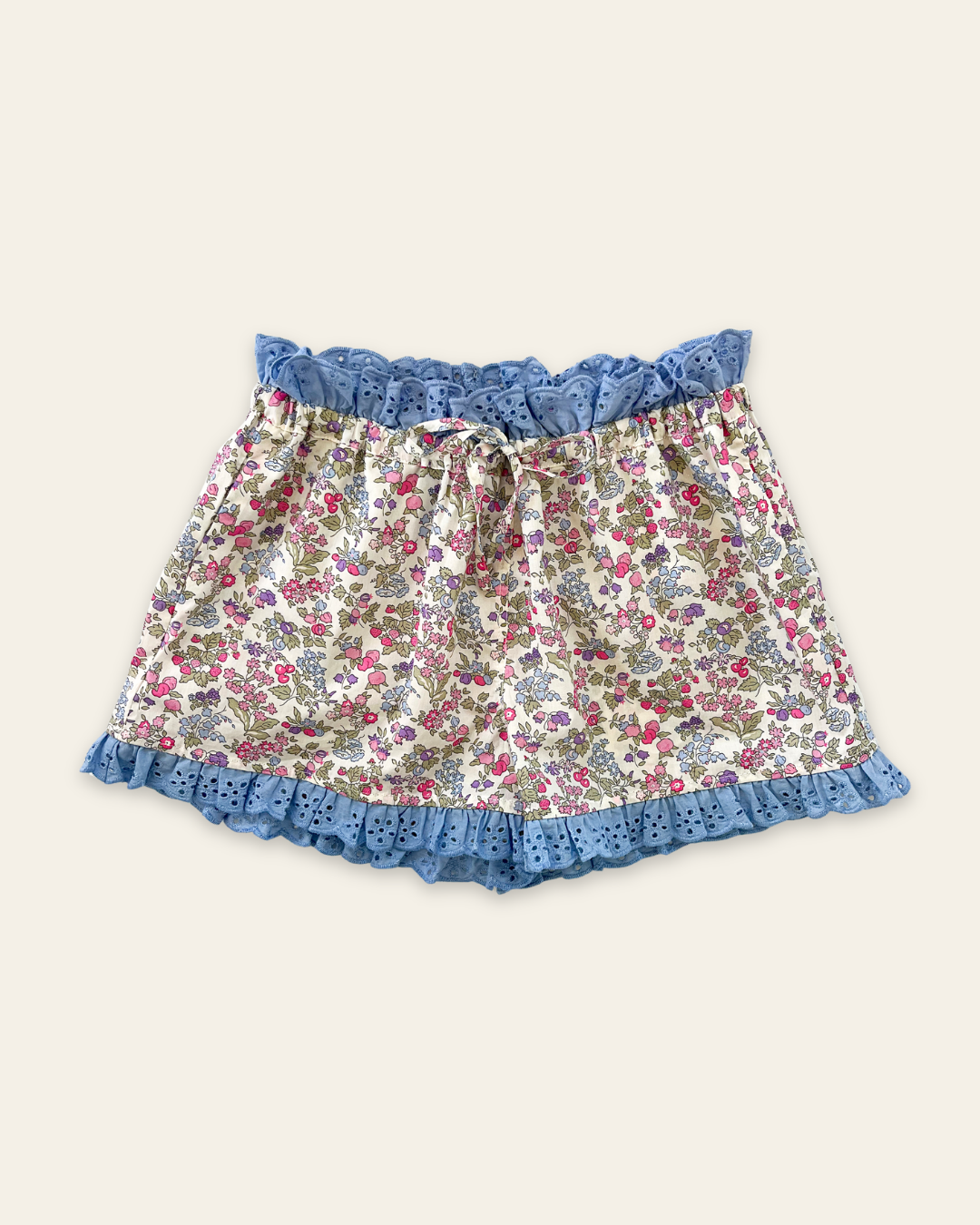 Elma Molly Shorts in Liberty Nancy Ann floral print, featuring embroidered lace trim, an elasticated self-tie waistband and side pockets.